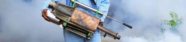 Fumigation technician using a fogger for deep pest treatment in Austin, TX